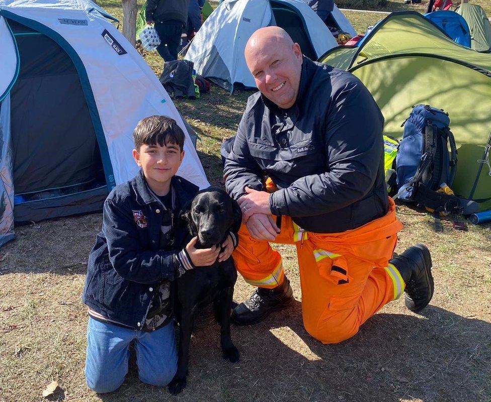 The K9 Search & Rescue NI team making new friends at the camp