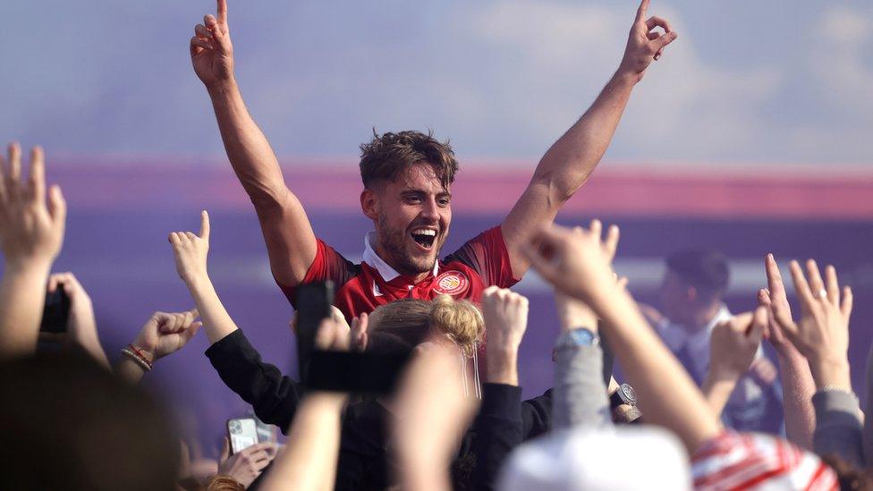 Stevenage's Danny Rose during celebrations of their side's promotion