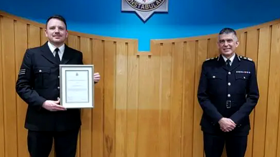 Chief Constable Andy Marsh presents Sgt Wright with his commendation