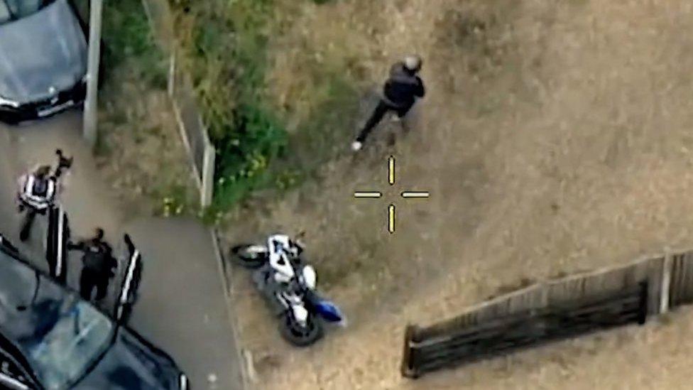 Aerial view of police chasing a motorcyclist