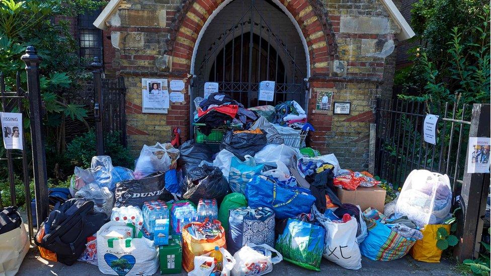 a huge pile of full plastic bags