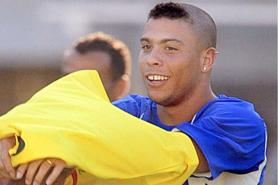 Ronaldo Nazário seen in 2002 with a shaved head except for a fringe at the front