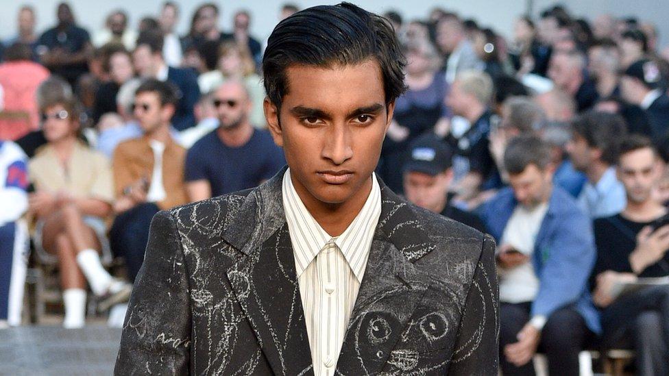 Jeenu Mahadeven modelling for the Alexander McQueen menswear show as part of Paris Fashion Week in 2018