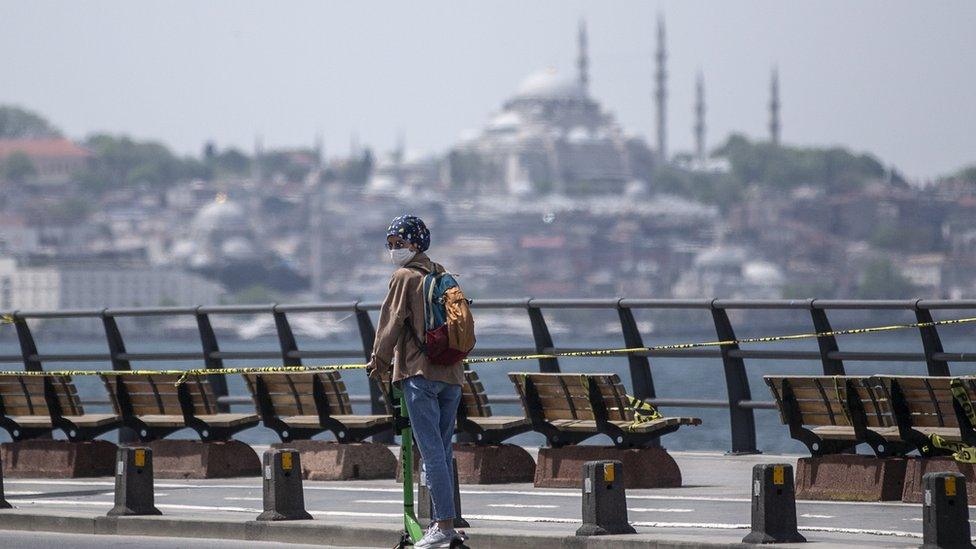 A woman riding a scooter in Istanbul