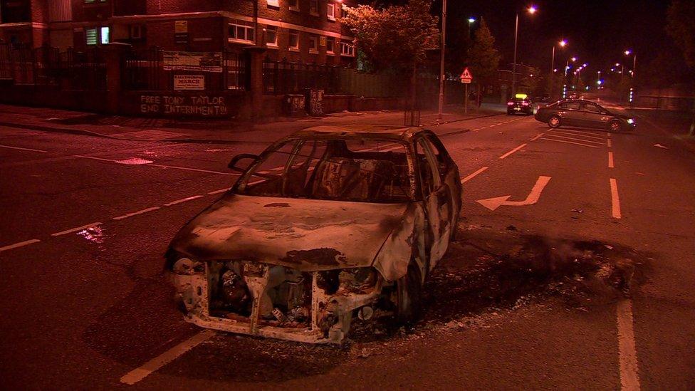 A car was burnt out in North Queen Street, near the New Lodge bonfire, on Tuesday