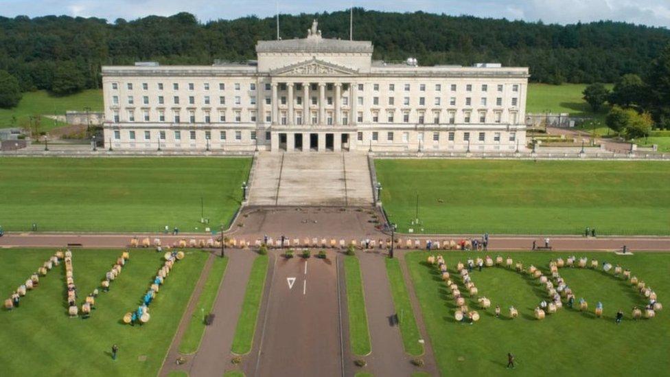 People gather outside Stormont with Lambeg drums