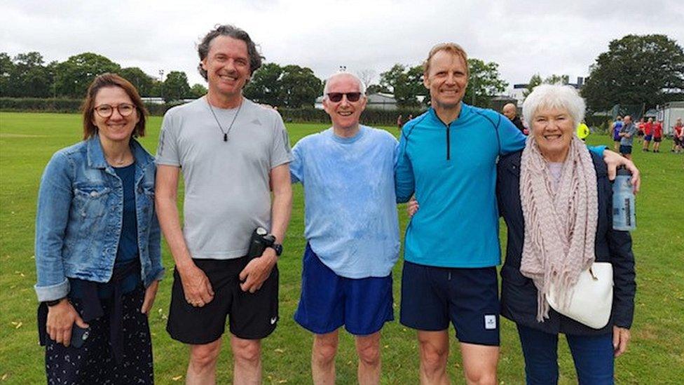 Dennis Carter with members of his family after a park run