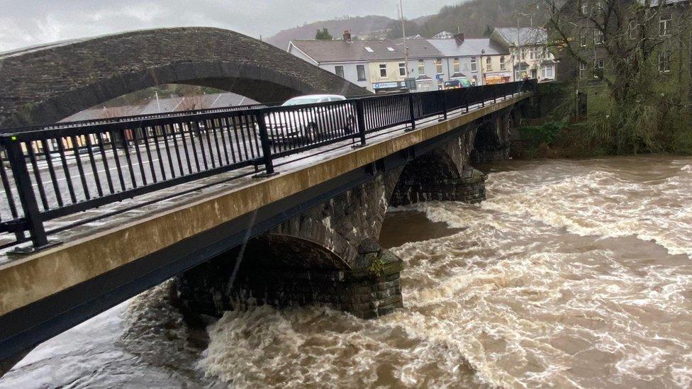 Car passes over river bridge at Pontypridd