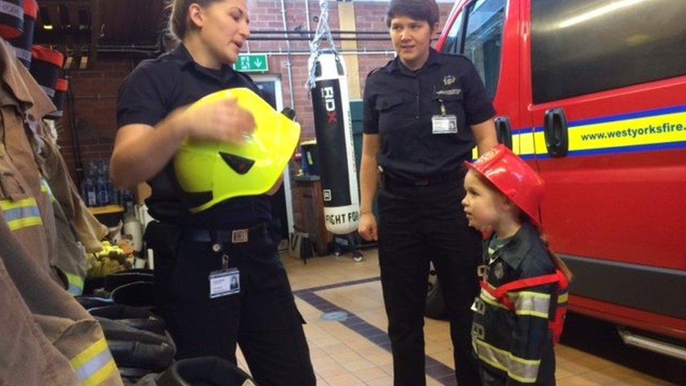 Firefighters Danielle Whitham and Emma Hawthorn with Grace