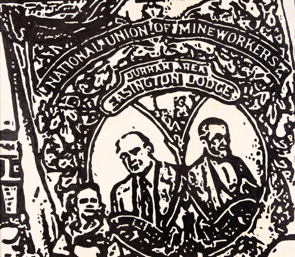 Black and white painting of people holding a banner