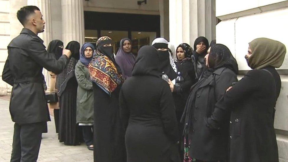 Protesters outside the court