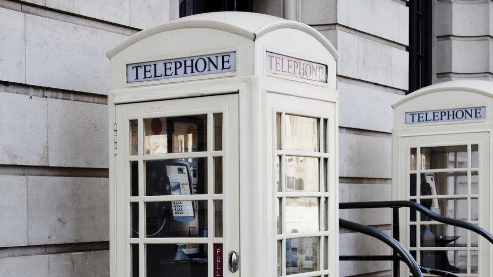 two cream Hull Phone boxes