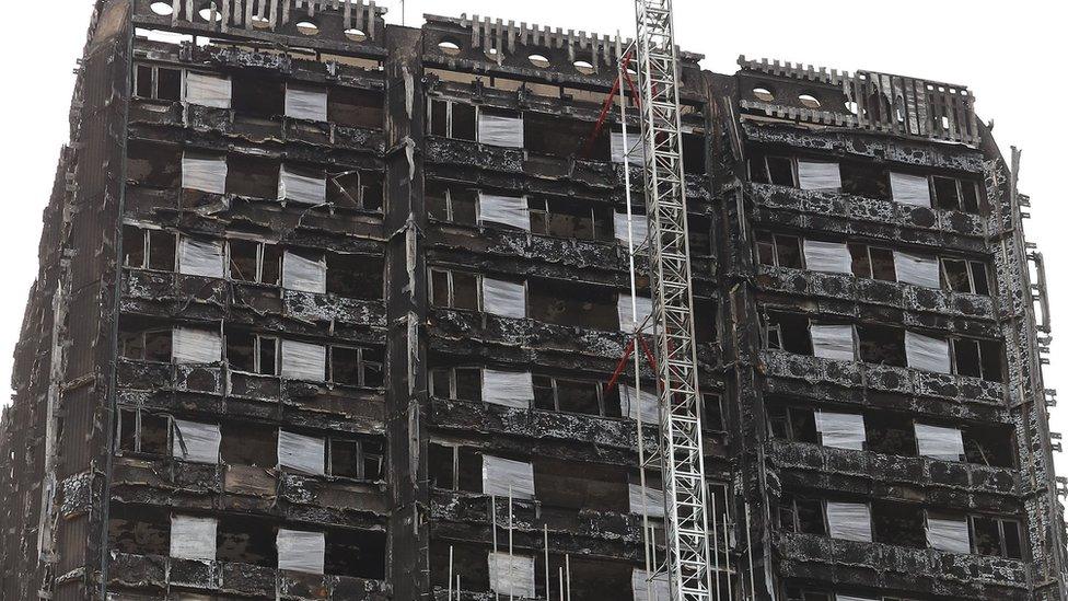 Grenfell Tower, four months after the fire. The crane is erecting a wrap to cover the tower.