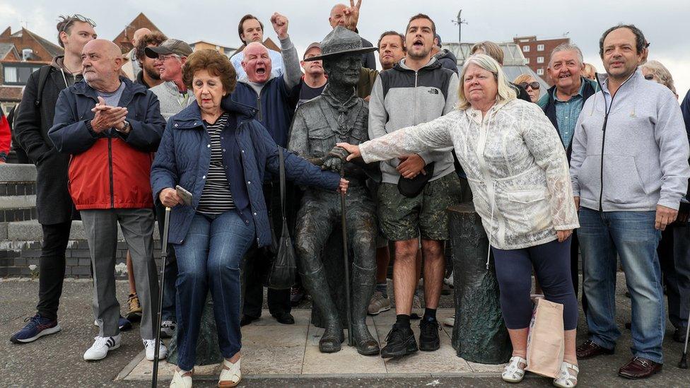 Local residents at statue