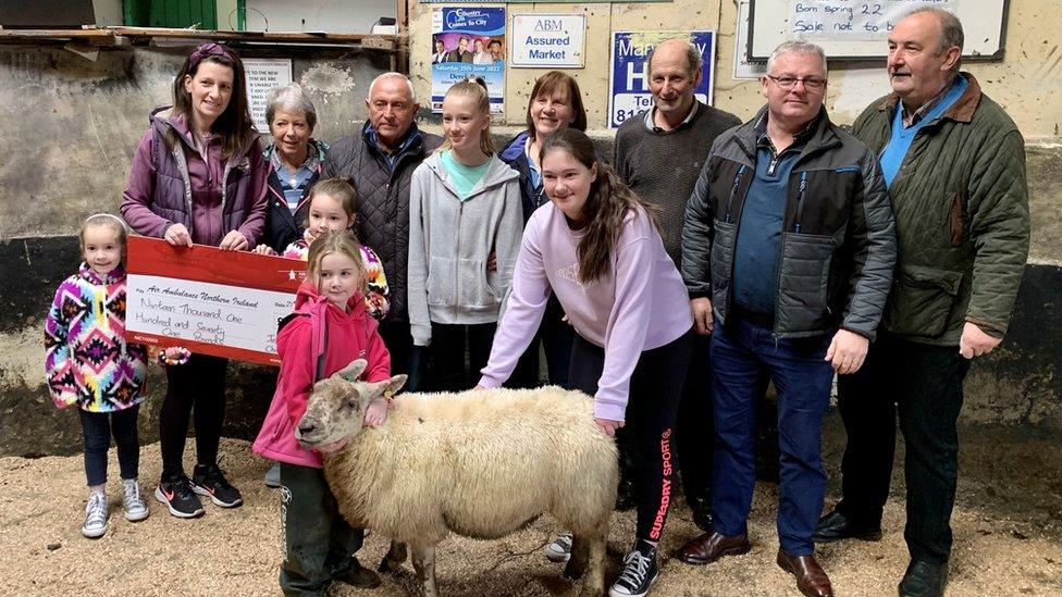 Georgia Hamilton (centre) handed over the cheque with her mum and three sisters