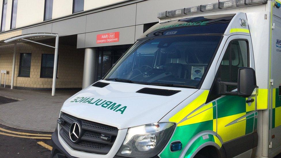 An ambulance waits outside an A&E department