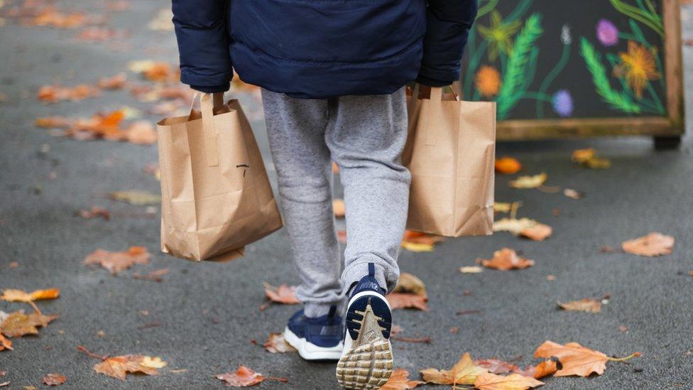 child with bags