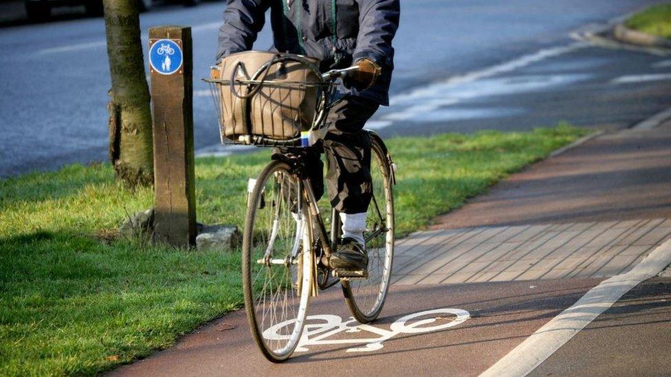 Cyclist riding bike