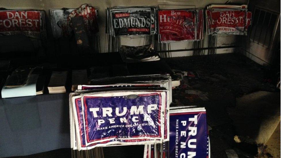 Melted campaign signs are seen at the Orange County Republican Headquarters in Hillsborough, NC on 16 October 2016.