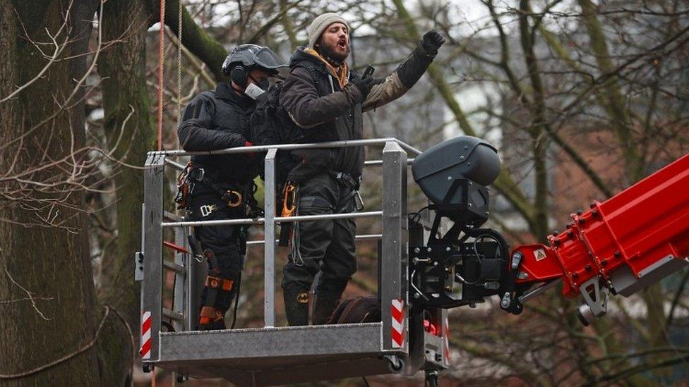 Protester on cherry picker