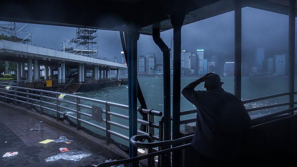 A man stands infront of Victoria Harbor on August 2, 2016 in Hong Kong, Hong Kong