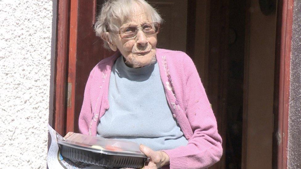 92 year old Gertie Primrose receiving her weekly meal delivery