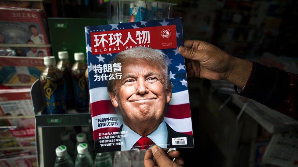 A copy of the local Chinese magazine Global People with a cover story that translates to "Why did Trump win" is seen with a front cover portrait of US president-elect Donald Trump (14 Nov)