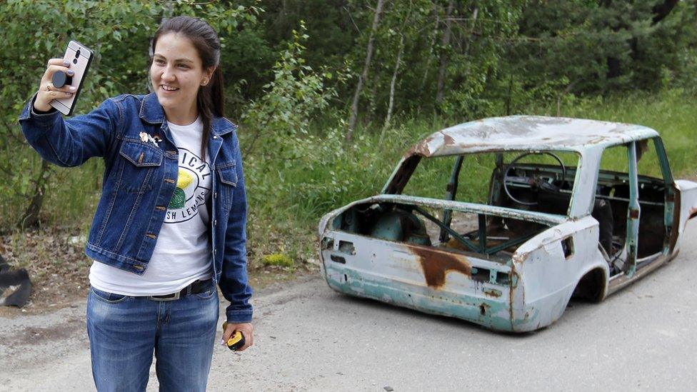 A visitor to Chernobyl takes a selfie