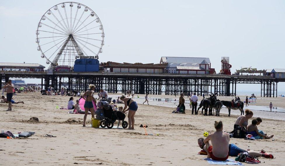 People enjoying the hot weather on Blackpool beach