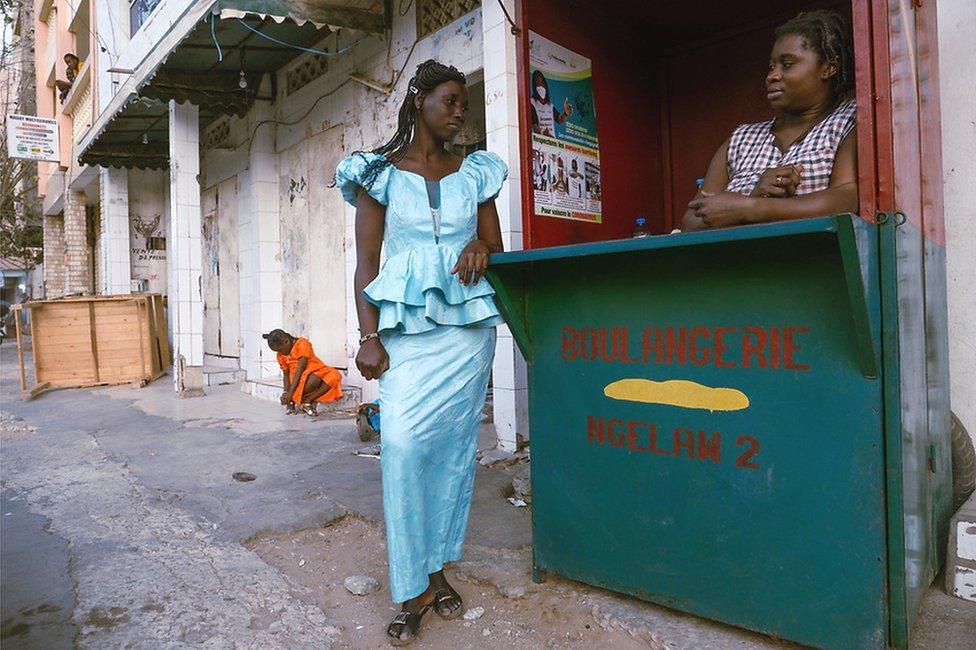 Ami Badji wears a pale blue boubou