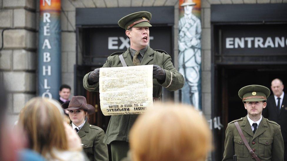 An actor posing as Irish Rebel leader Pádraig Pearse reads the 1916 Proclamation to tourists in Dublin