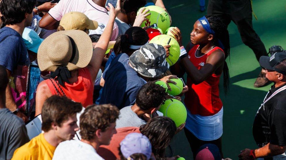 Coco-Gauff-surrounded-by-fans.