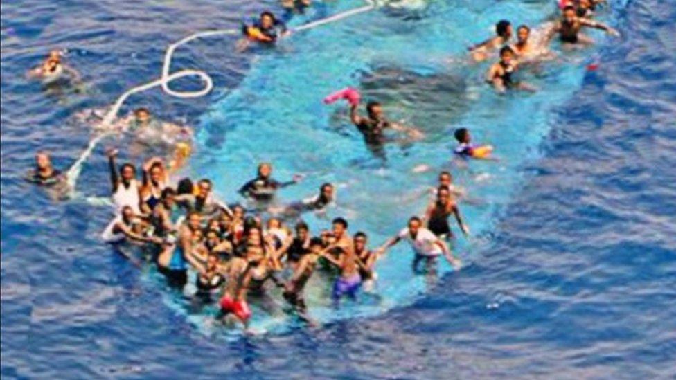 Migrants on capsized boat, 26 May