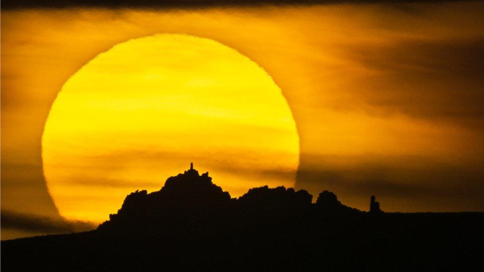 Sun setting behind Manstone Rock