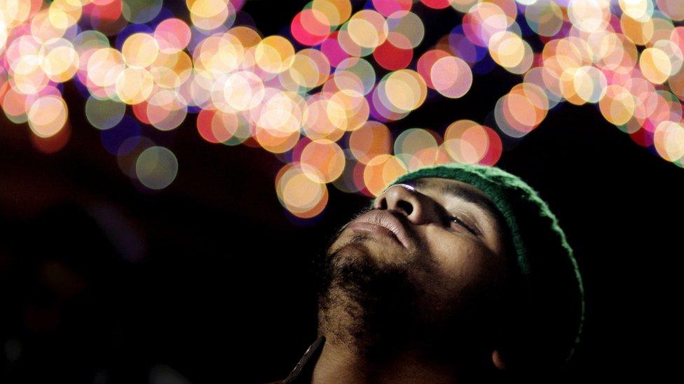 In this Wednesday, March 16, 2016 photo, a Muslim man performs Zikr, or remembrance of god, as he celebrates a Moulid, which commemorates the birth of Sayeda Nafisa, a descendant of the Prophet Muhammad through his grandson Hasan, in front of the mosque named after her, in Cairo, Egypt.