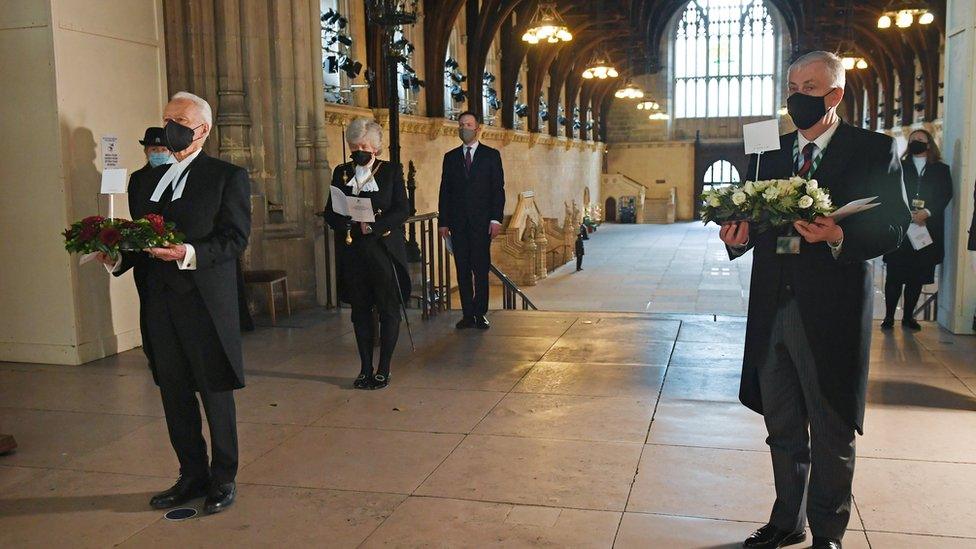 Lord McFall and Sir Lindsay Hoyle carrying wreaths