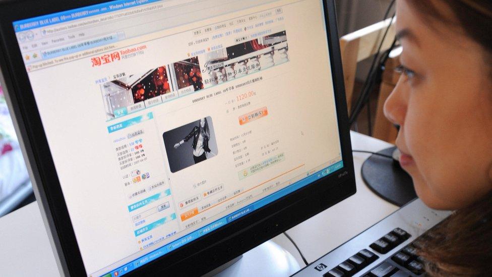 A woman in Beijing shops online at the Taobao website on February 5, 2008.