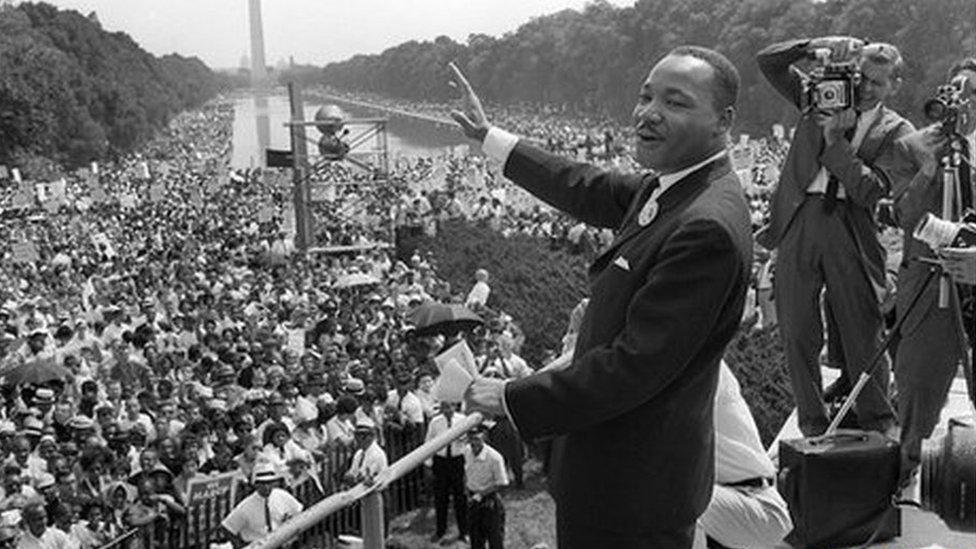 Martin Luther King waves to supporters from the steps of the Lincoln Memorial 28 August, 1963