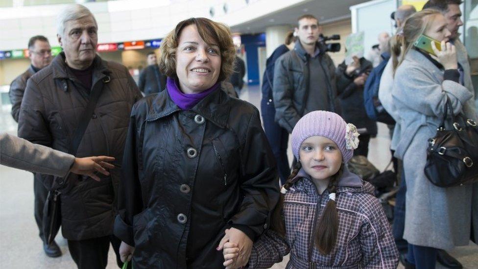 Russian tourists arrive from Hurghada at Domodedovo airport in Moscow, Saturday