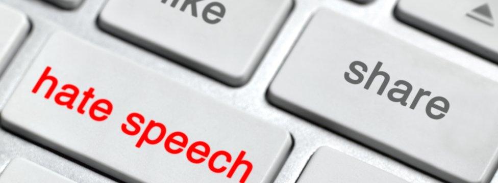 Words "hate speech" highlighted on a keyboard