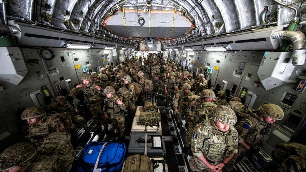 A member of British Forces from 16 Air Assault Brigade looks on upon arrival in Kabul, Afghanistan, to provide support to British nationals leaving the country