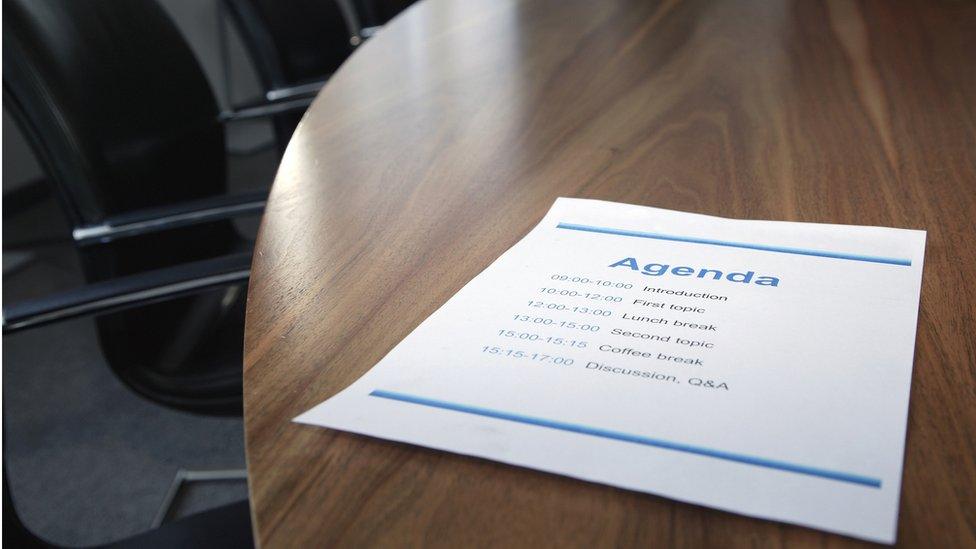 Table with agenda print out