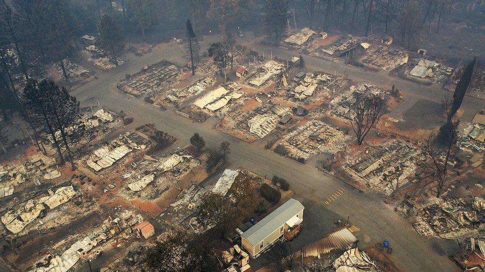 Trailer park is photographed in aerial shot as being totally destroyed