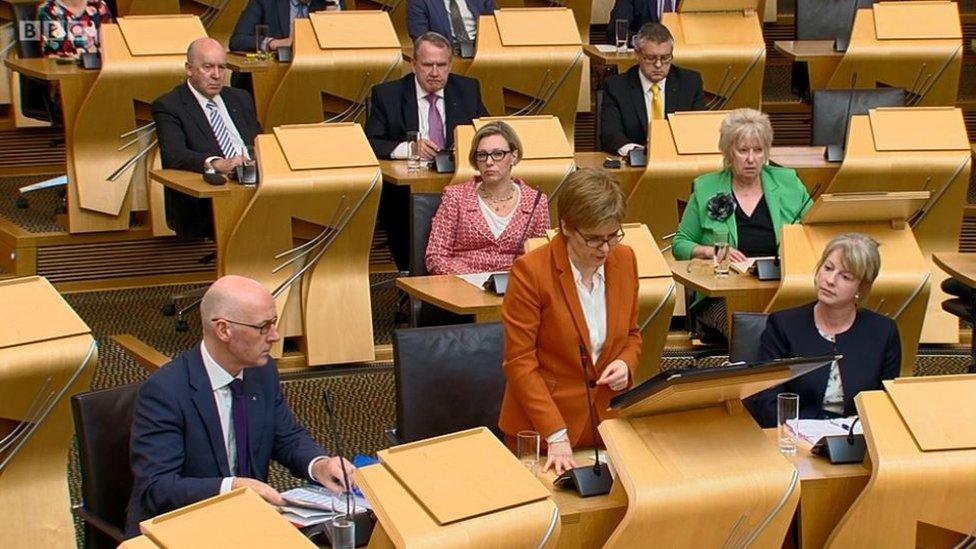 Shona Robison sitting next to Nicola Sturgeon