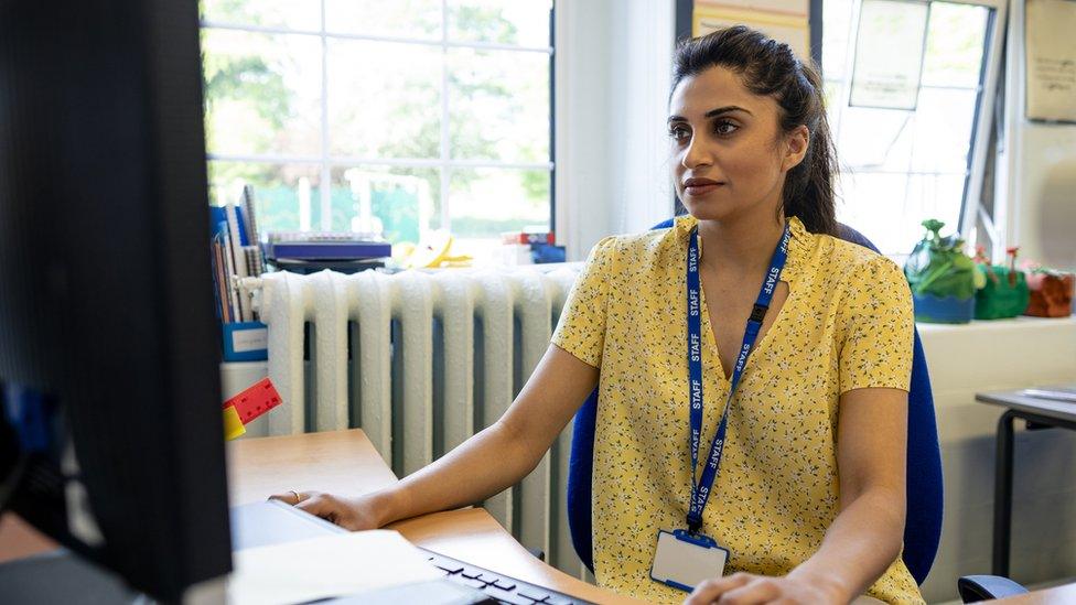 Teacher at desk