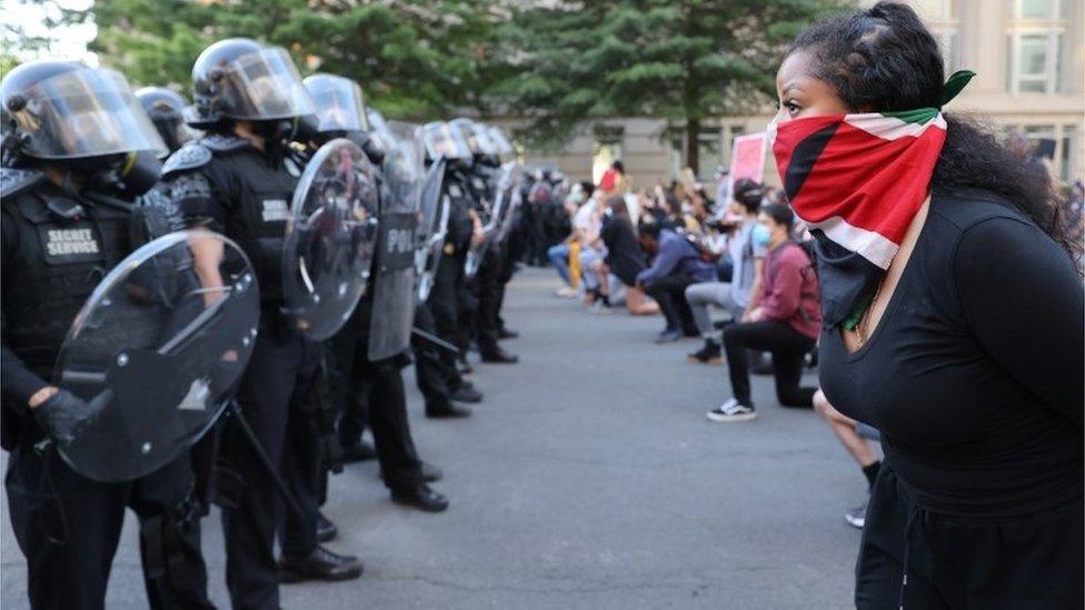 Demonstrators gather in front of U.S. Secret Service uniformed division officers during a protests against the death in Minneapolis custody of George Floyd, near the White House in Washington, D.C., U.S., June 1, 2020