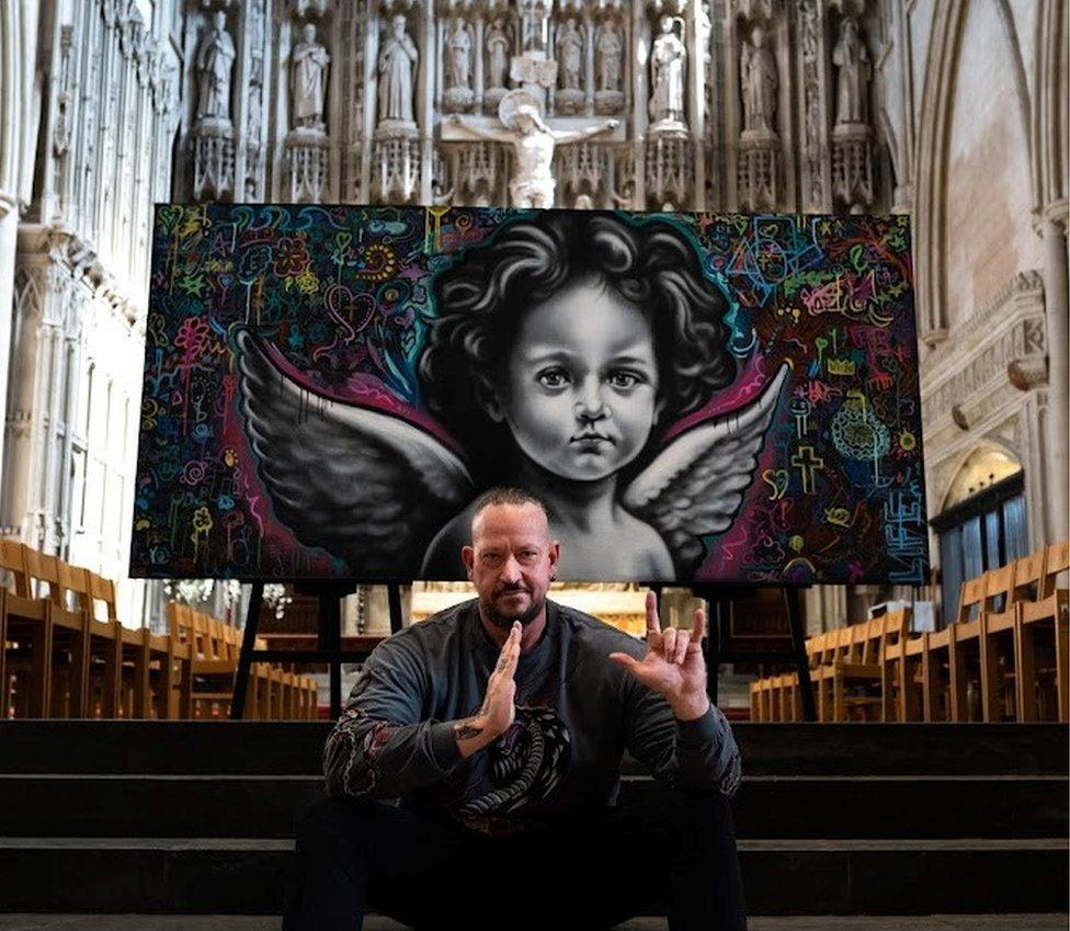 Ant Steel signing with his hands “God, I love you” with his hands after his first workshop at the cathedral