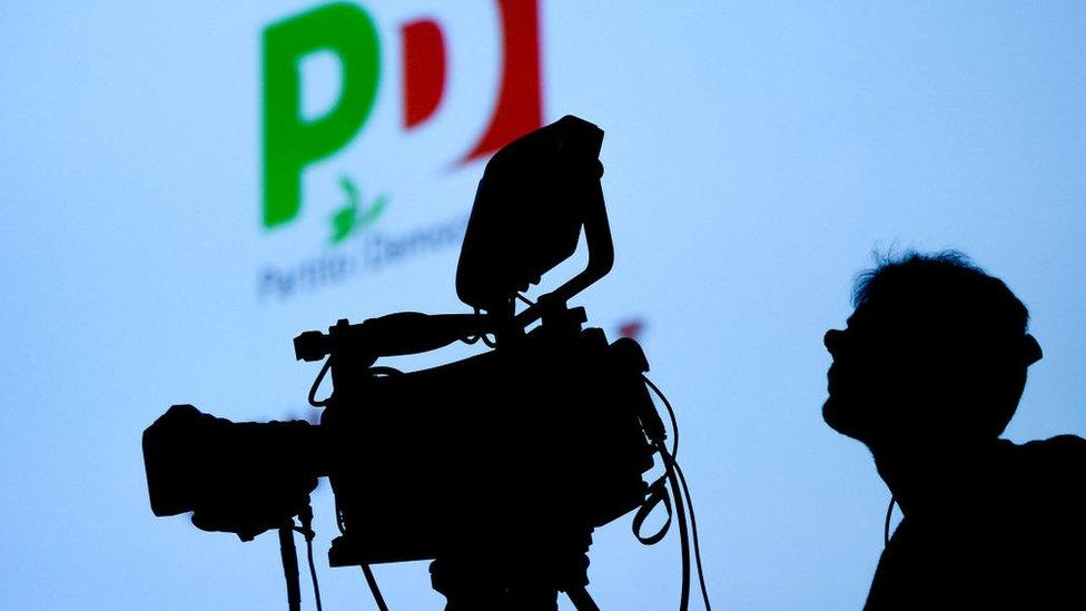 A TV camera is pictured during a meeting