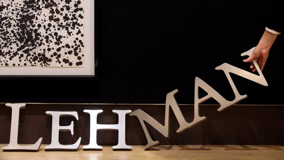 A Lehman Brothers sign is auctioned off