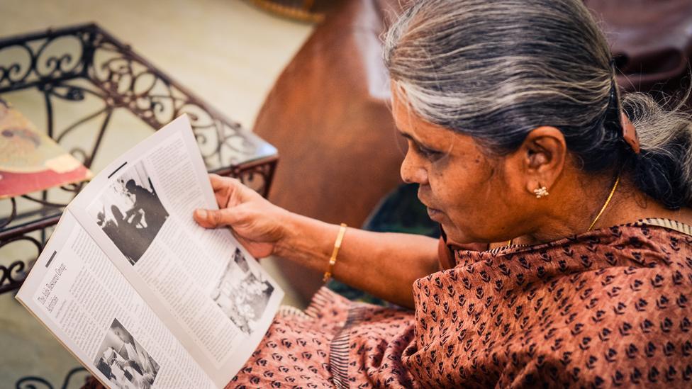 Nirmala reads some of her cuttings